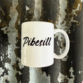 Nyssa Pibesill mug with colorful, playful design on white ceramic, ideal for hot beverages and everyday use.