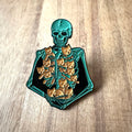 Nyssa kitten pin showing a cute cartoon kitten design with detailed metal craftsmanship, ideal for accessories or collection.