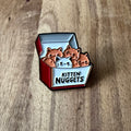 Nyssa Kitten Nuggets pin featuring a cute kitten design, perfect for accessorizing and showcasing playful style.