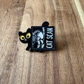 Nyssa Cat Scan pin featuring a detailed cat illustration, perfect for accessories or collector items.