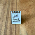 Nyssa To Do pin showing a colorful, round pin with "To Do" text, perfect for accessorizing bags or clothing.