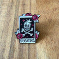 Black Death pin by Nyssa featuring a detailed skull design on a metal pin for accessories or collectibles.