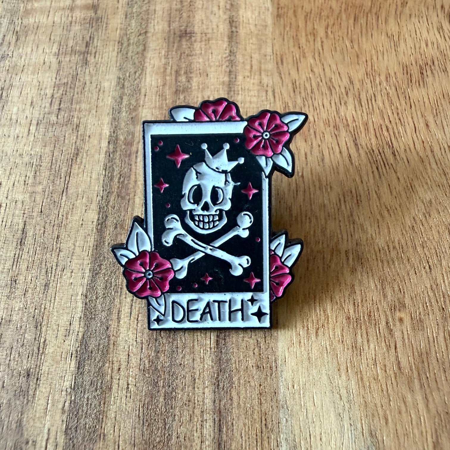 Black Death pin by Nyssa featuring a detailed skull design on a metal pin for accessories or collectibles.