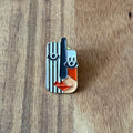 Nyssa Art2 pin featuring a colorful, artistic design with a metallic finish, displayed on a neutral background.