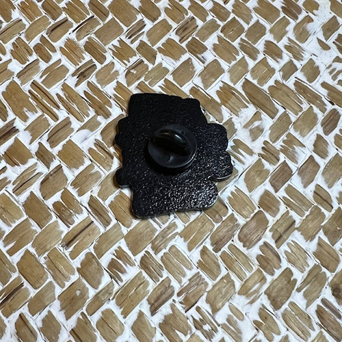 Black "Anti social" pin by Nyssa featuring bold text, metal pin backing, and a sleek design for casual wear.