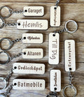 Custom wooden keychain by Nyssa with personalized engraved text on a laminated wood keyring.