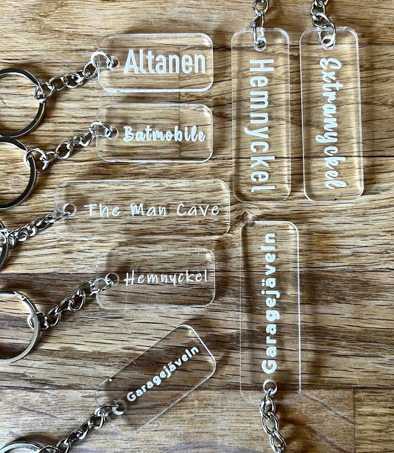 Transparent acrylic keyring with custom engraved text by Nyssa, showcasing a sleek and personalized accessory.