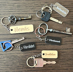 Transparent acrylic keyring with custom engraved text from Nyssa, showcasing a sleek and personalized accessory design.