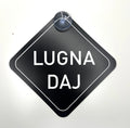 Skånska language car license plate with "Lugna Daj" phrase, branded by Nyssa, mounted on a vehicle.