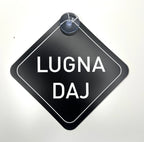 Skånska language car license plate with "Lugna Daj" phrase, branded by Nyssa, mounted on a vehicle.