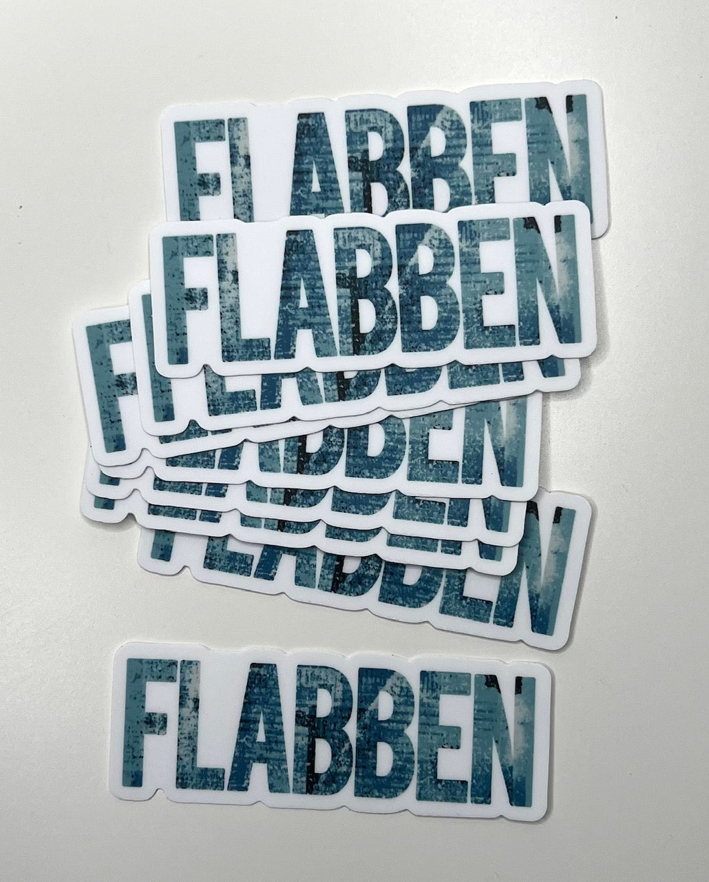 Skånska language sticker by Nyssa featuring the phrase "Säg det på Skånska" on a colorful adhesive sticker.