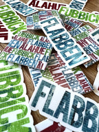 Skånska language sticker by Nyssa featuring "Säg det på Skånska" design, colorful adhesive sticker for decoration.