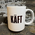 Nyssa Käft mug featuring a unique, artistic design with a smooth handle on white ceramic surface.