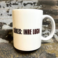 Nyssa Sökes: Inre lugn ceramic mug with calming design, perfect for tea or coffee.
