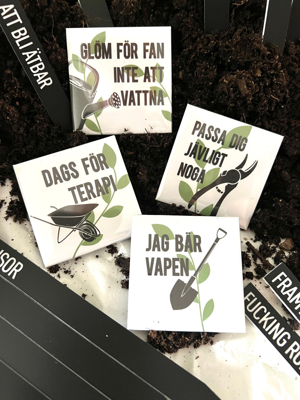 Set of four Nyssa Det våras refrigerator magnets with colorful spring-themed designs, perfect for decorating your fridge.