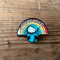 Nyssa "You’re Next!" enamel pin featuring bold black lettering on a circular design, perfect for jackets or backpacks.