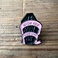 Nyssa "Wish You Were Here" pin featuring a colorful design, perfect for accessories or collectible display.
