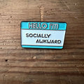 Nyssa "Hello I’m socially awkward" pin featuring a colorful design, perfect for expressing personality on clothing or bags.