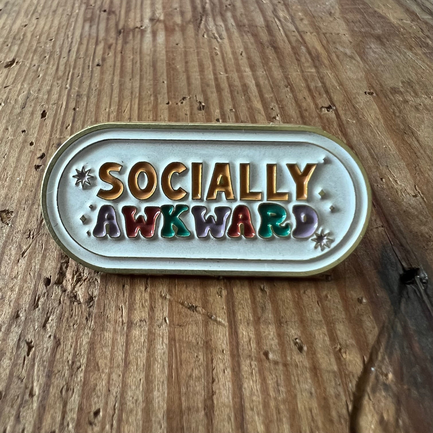 Socially Awkward Nyssa pin featuring a humorous design, perfect for expressing personality on clothing or accessories.