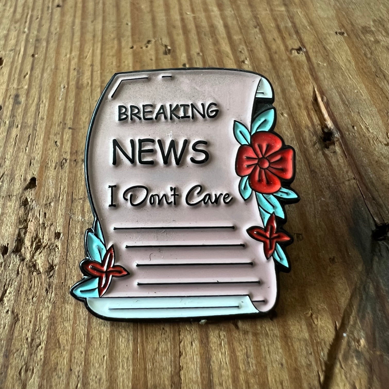 Breaking News pin by Nyssa featuring a vibrant design, perfect for accessorizing clothing or bags with a bold statement.