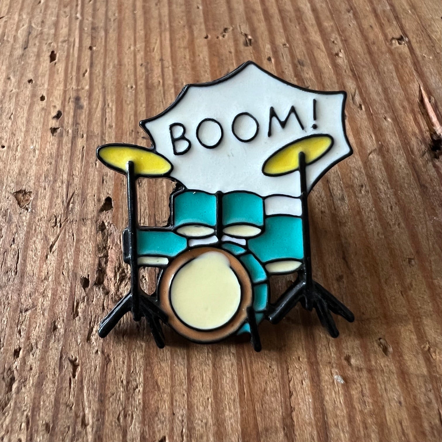 Nyssa BOOM! pin featuring bold, colorful design, perfect for accessorizing bags or clothing with vibrant style.