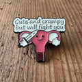 Nyssa Cute and Crampy pin featuring a playful design, showcasing colorful enamel details on a metal pin back.