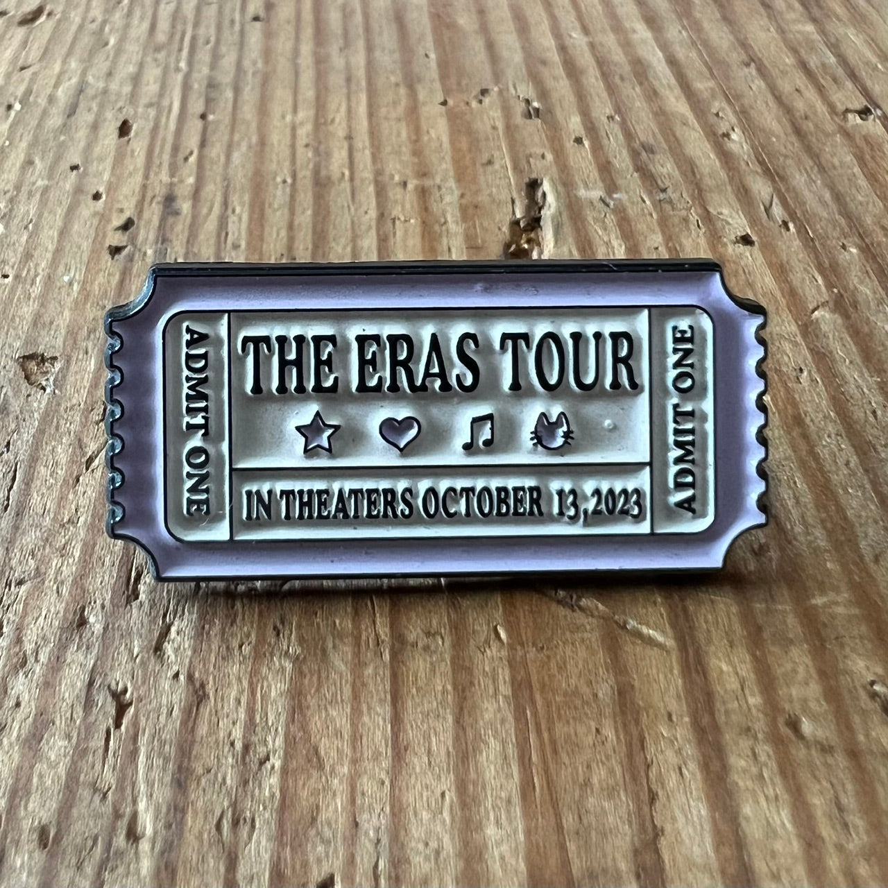 Nyssa The Eras Tour pin featuring a colorful, collectible enamel design with a butterfly motif.