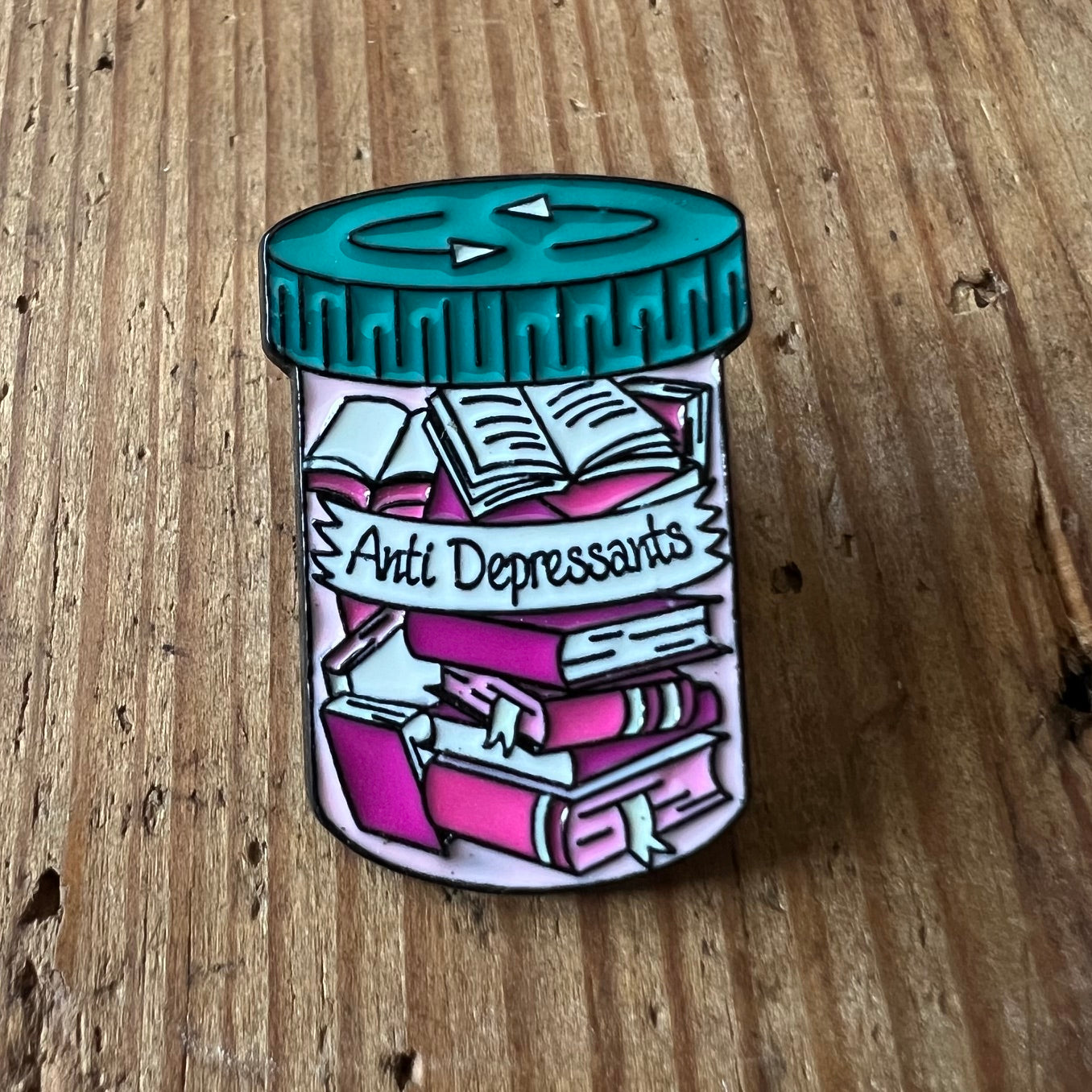 Nyssa anti-depressant pin featuring a sleek design, perfect for expressing support and awareness on clothing or accessories.
