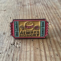 Always Hungry Nyssa pin featuring a colorful, enamel design of a hungry character, perfect for clothing or accessories.