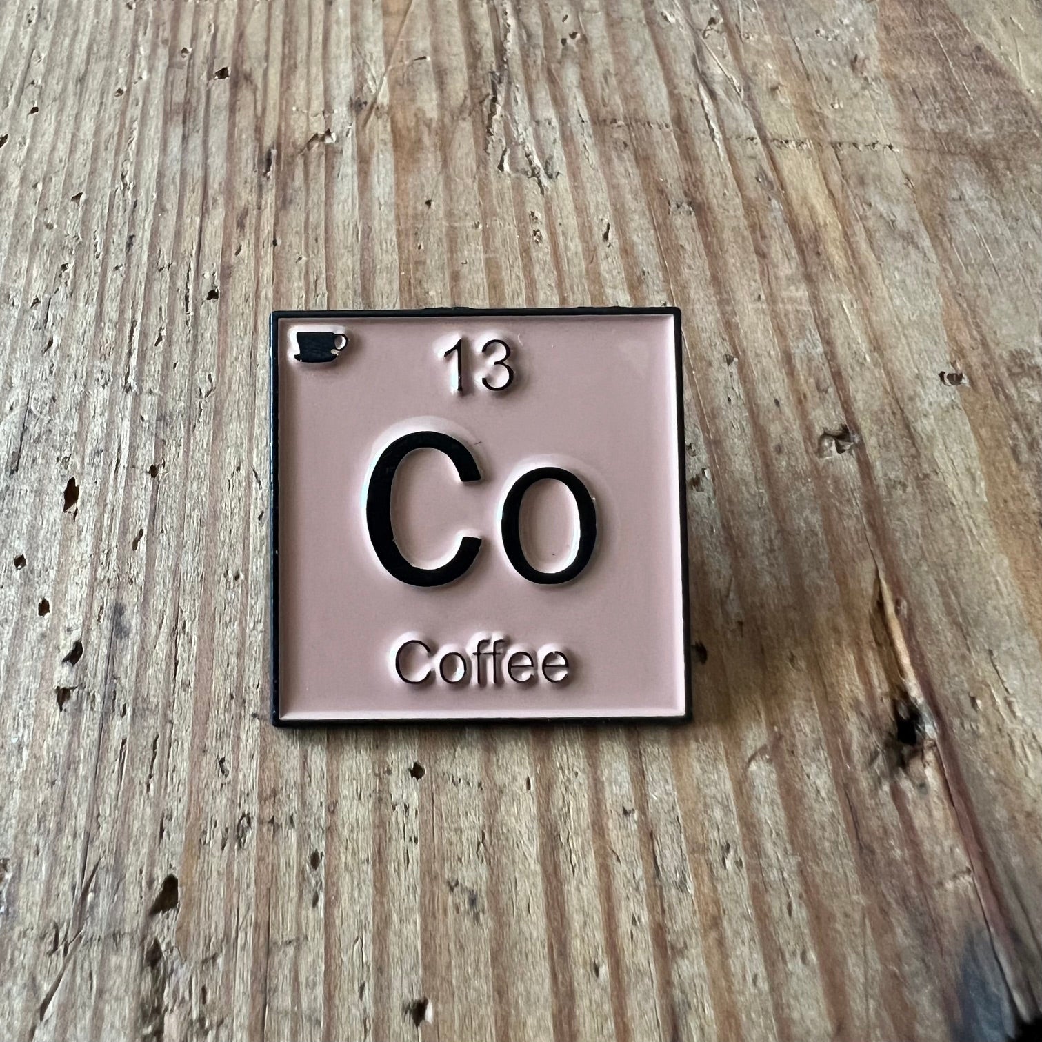Nyssa coffee-themed pin featuring a detailed coffee cup design, perfect for accessories or enamel pin collections.
