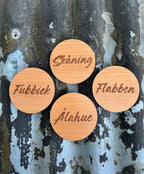 Nyssa Skåning glassunderlägg with a decorative pattern, placed on a table for protecting surfaces from drink condensation.