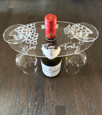 Nyssa glass holder for bottles, sleek and functional design, mounted on a surface for secure bottle placement.