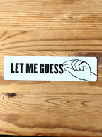 Colorful Nyssa "Let me guess" sticker with bold text and playful design, perfect for decorating laptops or notebooks.