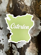 Nyssa Skåne Österlen magnet showing a scenic view of southern Sweden with vibrant colors and detailed landscape imagery.