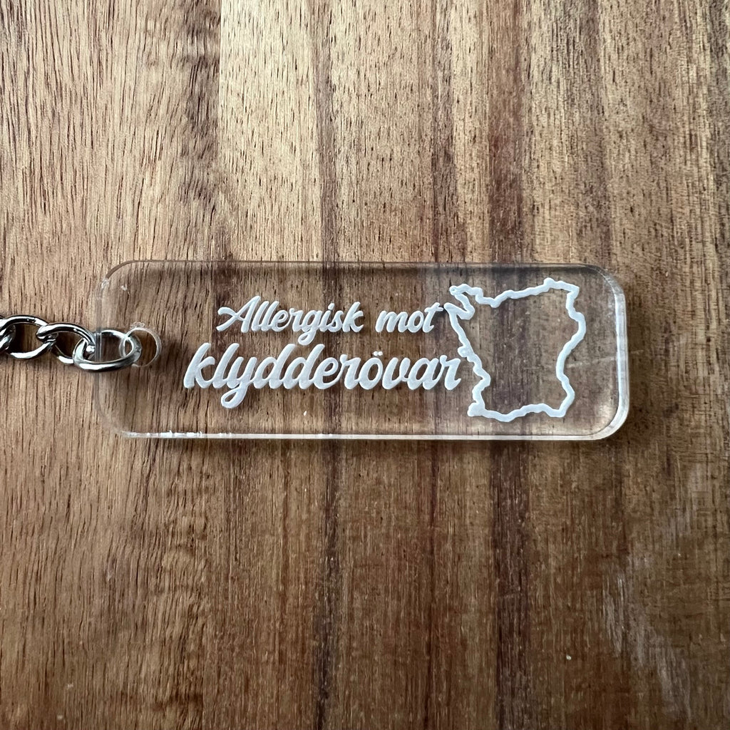 Nyssa Skåne keyring featuring a design inspired by the region, perfect for adding a touch of local charm to your keys.