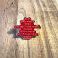 Nyssa "Don't You Worry" enamel pin featuring a colorful design, shown on a white background.