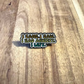 Nyssa "I Came, I Saw..." pin featuring a colorful design, showcasing a metal pin with engraved text on a plain background.