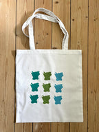 Nyssa Skåne fabric tote bag with handles, showcasing a natural, durable textile design on a white background.