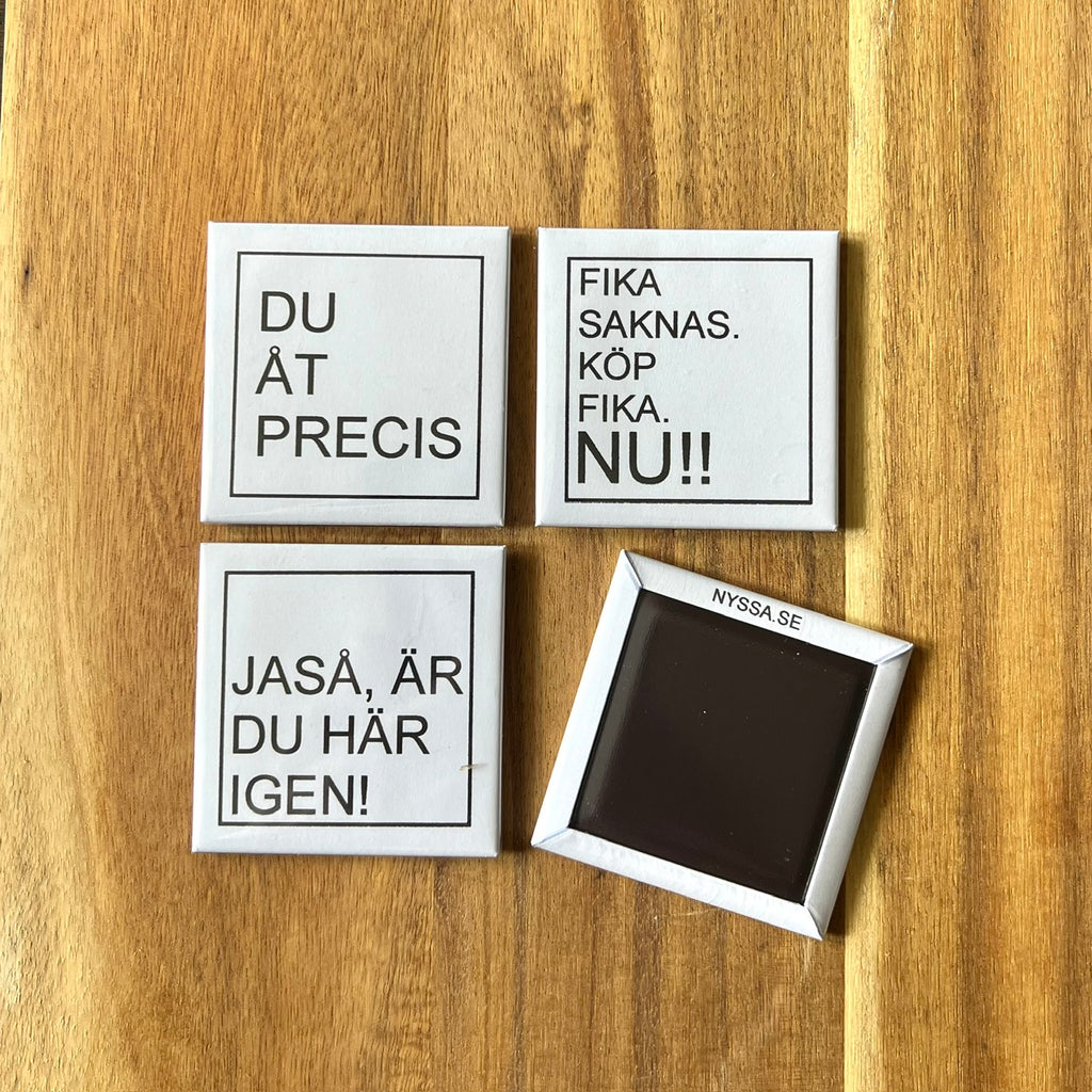 Set of four Nyssa LET'S FIKA refrigerator magnets with colorful coffee cup and pastry designs on a white background.