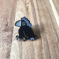 Nyssa Crow pin featuring a detailed metal crow design, perfect for accessories or collectibles.