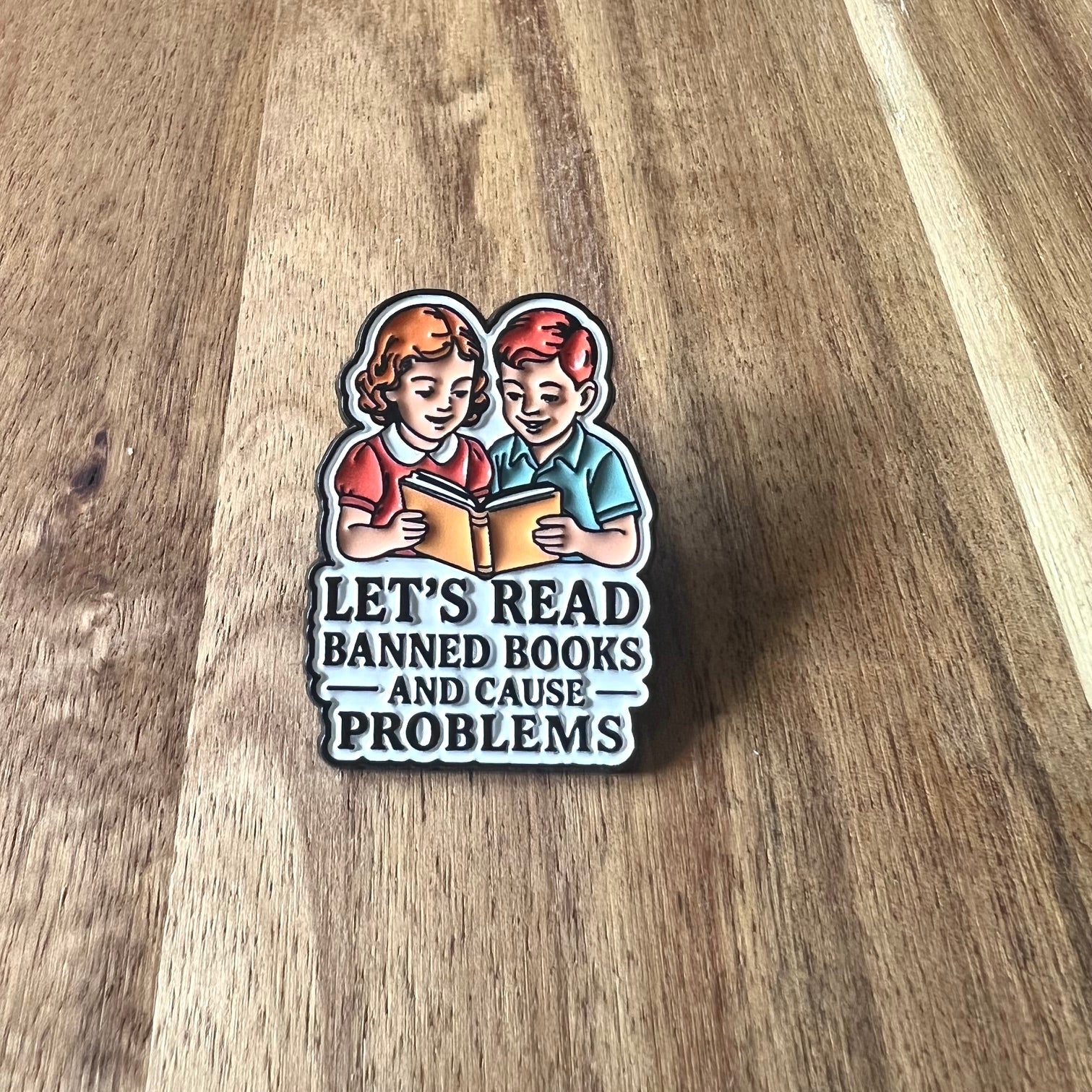 Nyssa Let's Read pin featuring colorful letters and a playful design, perfect for book lovers and reading enthusiasts.