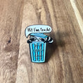 Nyssa "Hi! I’m Trash" enamel pin featuring a playful design, perfect for adding quirky flair to jackets or backpacks.