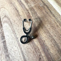 Nyssa nurse pin featuring a detailed design, ideal for medical professionals and nurse enthusiasts, displayed on a white background.